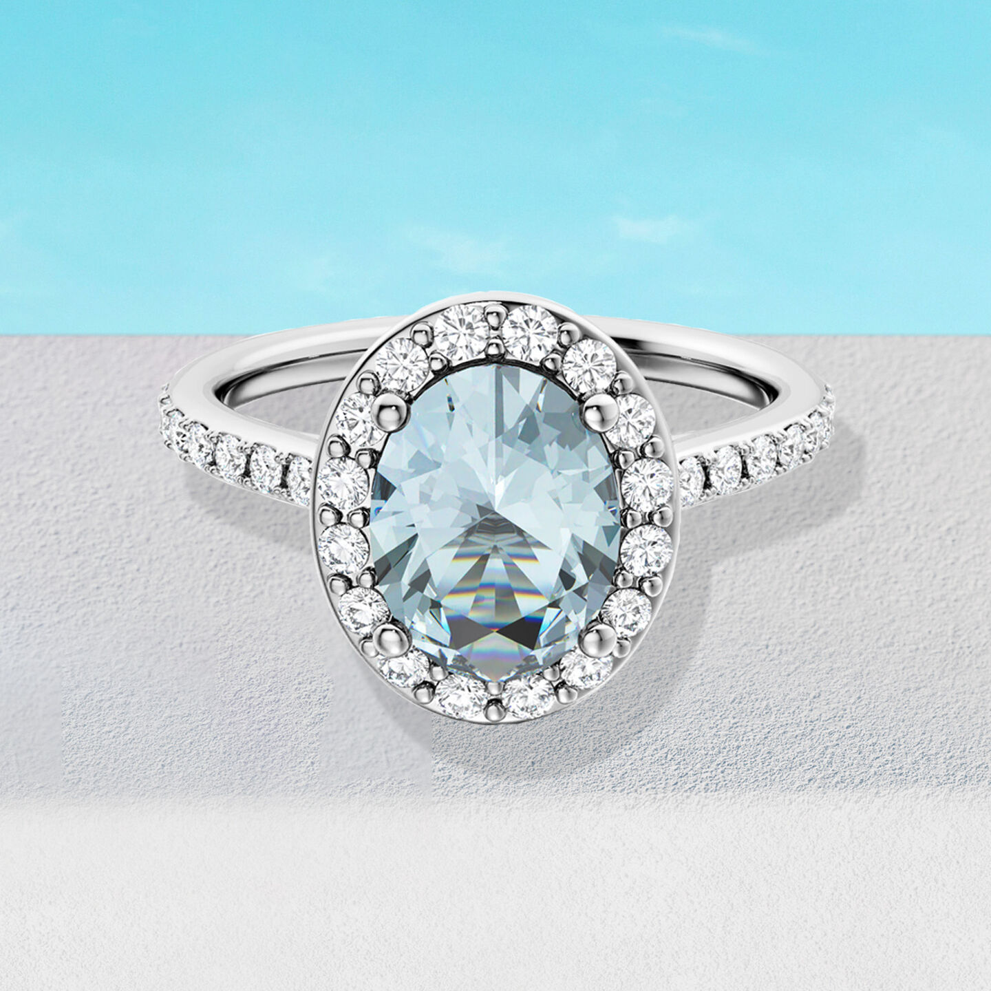 Birks Rosee du Matin aquamarine engagement ring on a blue background.
